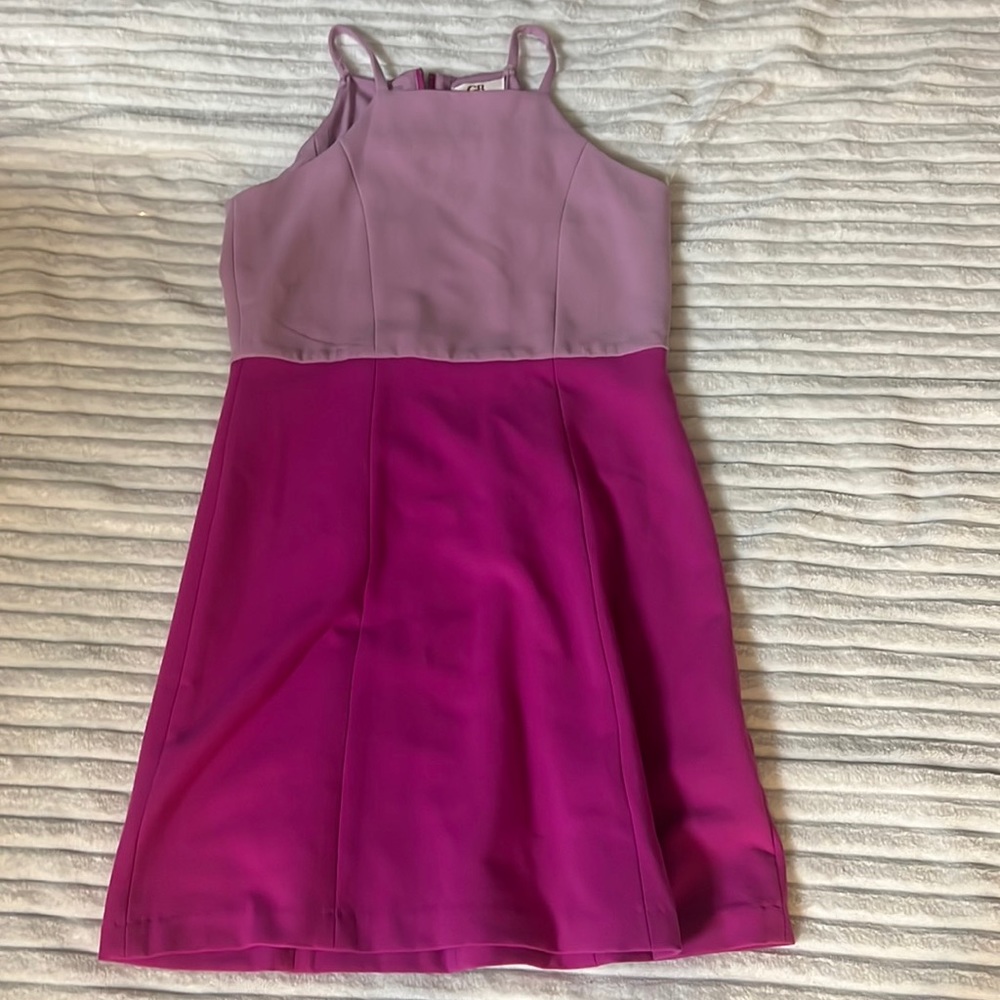 Too half purple and bottom half pinkish purple dress with zipper in the back .